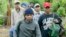 Montagnards emerge from the forest after having fled from neighbouring Vietnam in Korng village, Ratanakiri province, northeastern Cambodia, 10 kilometers (6.3 miles) from the Vietnamese border, in this Thursday, July 22, 2004 file photo. Twenty-seven Vie