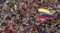 Opposition supporters march protest against Nicolas Maduro's government in Caracas, Feb. 22, 2014. 