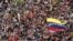 Opposition supporters march protest against Nicolas Maduro's government in Caracas, February 22, 2014. 