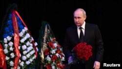 Russian President Vladimir Putin pays his respects to late Head of the Republic of Bashkortostan Murtaza Rakhimov in Ufa