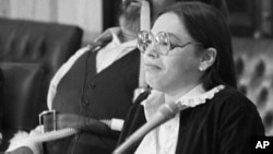 FILE - Judy Heumann, a former State of California rehabilitation agency employee, and Ed Roberts, left, director of the California State Department of Rehabilitation, take part in a news conference on Oct. 21, 1982. 