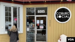 Customers line up in front of Halifax cafe Coburg Social, which has maintained a take-out window throughout the pandemic. (Jay Heisler/VOA)