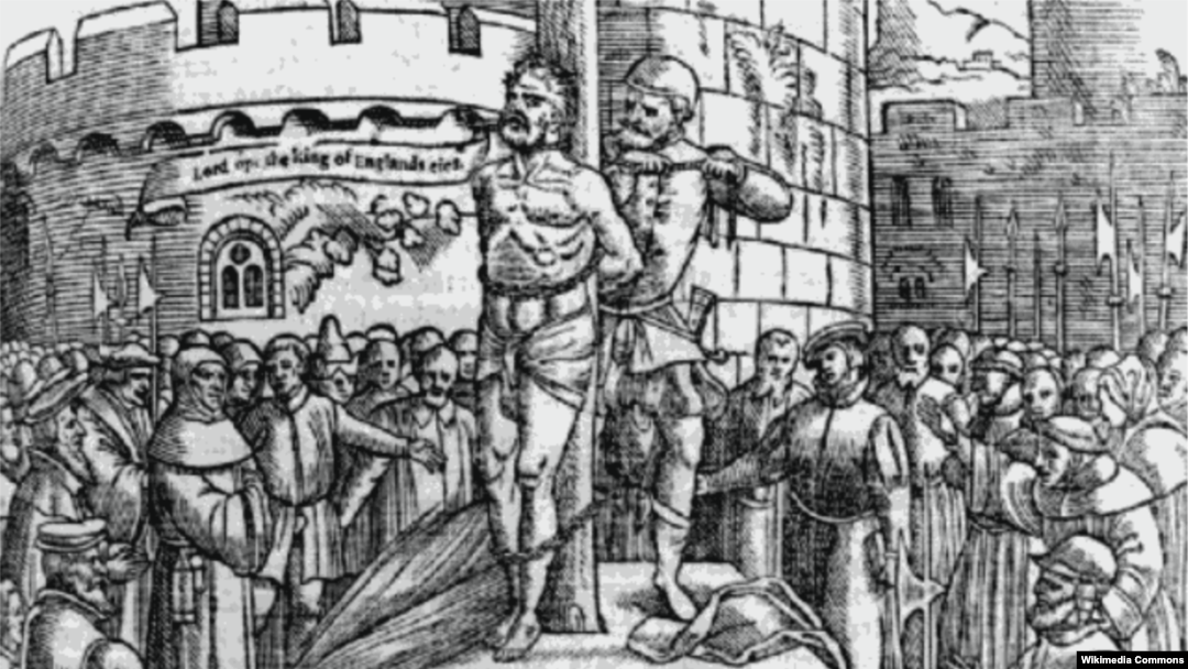 William Tyndale is burnt at the stake in Belgium; he cries, "Lord ope the king of England's eies." From an Elizabethan edition of Foxe's Martyrs. (Wikimedia)