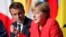 FILE - French President Emmanuel Macron and German Chancellor Angela Merkel attend a news conference following talks on European Union integration, defense and migration at the Elysee Palace in Paris, Aug. 28, 2017.