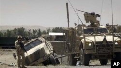 A demonstrator throws rocks at police outside the central train station, during protest against the increase on bus fares in Rio de Janeiro, Feb. 6, 2014. 