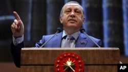 Turkish President Recep Tayyip Erdogan speaks during a meeting in Ankara, Turkey, Oct. 12, 2016.