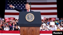 U.S. President Donald Trump reacts with supporters during a campaign rally in Panama City Beach, Fla., May 8, 2019. 