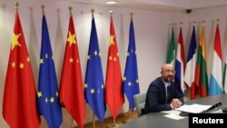 FILE - European Council President Charles Michel takes part in a virtual summit with Chinese President Xi Jinping in Brussels, Belgium, June 22, 2020. 