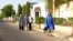 Women walk in a street in a residential area in Maiduguri, Borno State May 19, 2013, an area where President Goodluck Jonathan has declared a state of emergency.
