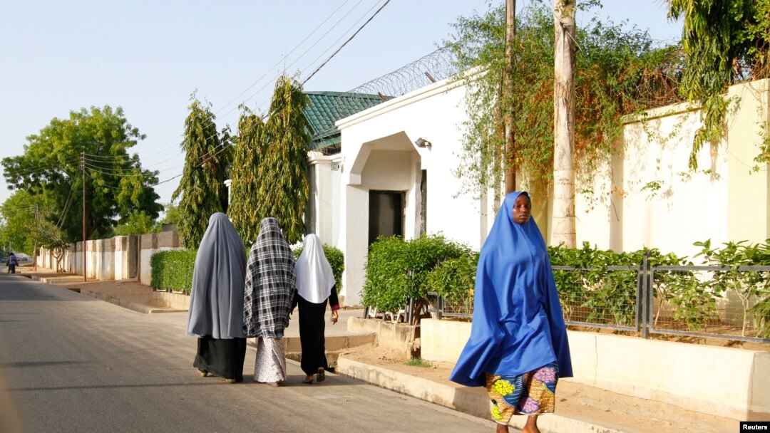 Women walk in a street in a residential area in Maiduguri, Borno State May 19, 2013, an area where President Goodluck Jonathan has declared a state of emergency.