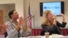 College of Charleston students Cora Webb, left, and ‘candidate’ Chelsea Roland celebrate their election victory in a mock campaign calling for self-defense classes in Charleston, South Carolina. (C. Guensburg/VOA) 