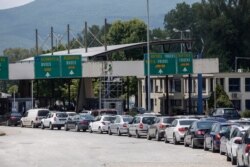 Cars queue at Promahonas border crossing with Bulgaria, which is the only land border into Greece that is open, July 6, 2020.