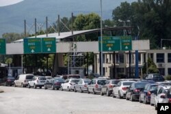 Cars queue at Promahonas border crossing with Bulgaria, which is the only land border into Greece that is open, July 6, 2020.