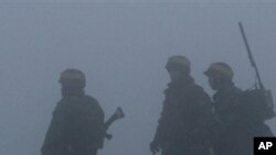 South Korean Marines patrol on Yeonpyeong island, South Korea, ahead of expected live-fire artillery exercises, Dec. 20, 2010.