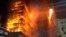 In this photo released by Sao Paulo Fire Department, a building on fire is seen in Sao Paulo, Brazil, May 1, 2018. 
