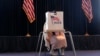 A voter works on her ballot at a polling station at the Ronald Reagan Presidential Library, on Election Day, Nov. 5, 2024, in Simi Valley, California.