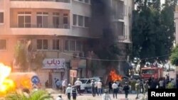 Explosive devices blow up near a hotel where French President Emmanuel Macron was meant to be staying, in Damascus