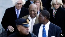 Bill Cosby, center, departs a pretrial hearing in his sexual assault case at the Montgomery County Courthouse, March 5, 2018, in Norristown, Pennsylvania.