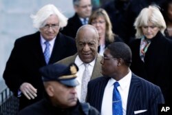 Bill Cosby, center, departs a pretrial hearing in his sexual assault case at the Montgomery County Courthouse, March 5, 2018, in Norristown, Pennsylvania.