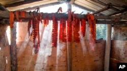 Salmon hangs on a drying rack at a fish camp in Fort Yukon, Alaska, in this undated photo provided by the Tanana Chiefs Conference.