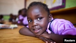 FILE - A four-year-old deaf student sits inside her classroom in the specialized deaf unit program at the Little Rock Inclusive Early Childhood Development Center in Kenya's capital Nairobi.