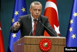 Turkey's President Tayyip Erdogan speaks during a news conference in Ankara, Turkey, Sept. 9, 2015.