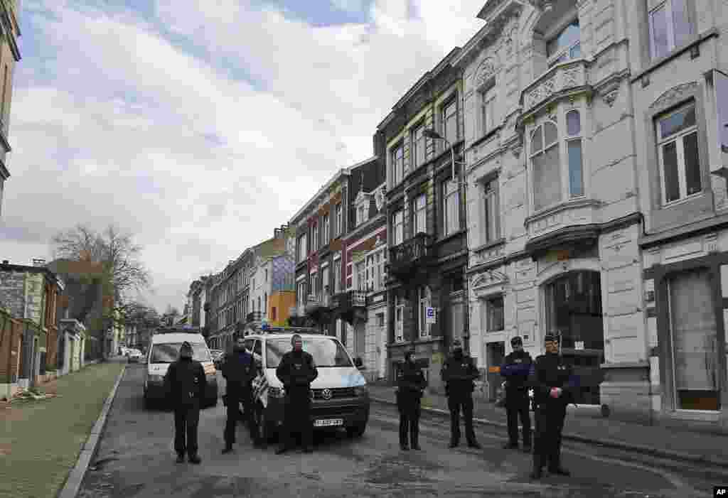 Police blocked a street after security forces conducted anti-terrorist raids in Verviers, eastern Belgium, Jan. 16, 2015.
