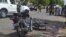 FILE - Security officers are seen standing at the site of a suicide bombing in Ndjamena, Chad, June 15, 2015. Ten men were executed Saturday in connection with this and another attack.