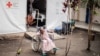 A 5-year-old girl, sitting in her wheelchair, waits to be treated at the ICRC hospital, in Goma, on Jan. 20, 2025. 