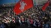 Belarusian opposition supporters light phones lights during a protest rally in front of the government building at Independence Square in Minsk, Belarus, Aug. 22, 2020. 