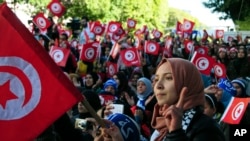 FILE - Tunisians celebrate the fifth anniversary of the Arab Spring, in Tunis, Jan.14, 2016. A new Arab Youth Survey found just five years after the Arab spring, a majority of respondents prioritized stability over democracy in the region. 