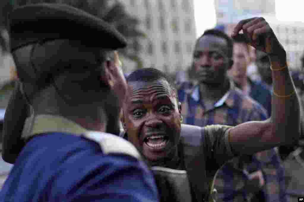 Fiston Adumba, 32, an opposition supporter, reacts to Corneille Nangaa, Congo&#39;s elections chief,&nbsp; announcing the postponement of the elections, in Kinshasa, Democratic Republic of the Congo.