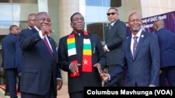 South African President Cyril Ramaphosa, Zimbabwean President Emmerson Mnangagwa, Botswanan President Duma Boko and SADC Executive Secretary Elias Magosi gather before their meeting on the conflict in Democratic Republic of Congo, in Mount Hampden, Zimbabwe, on Jan. 31, 2025.