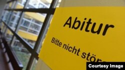 A sign at a German school announces the Abitur exam taken by German students at the end of their high school years. (Change.org)