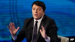 FILE - Former Italian prime minister Matteo Renzi gestures during a TV program, in Milan, Italy, Feb. 26, 2017.