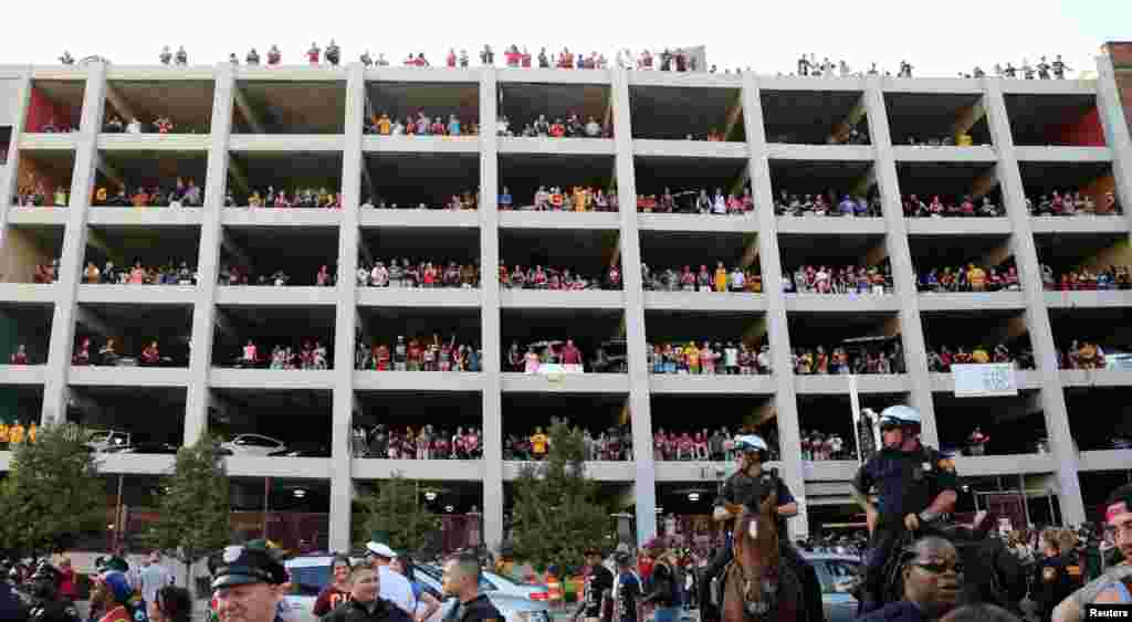 Cleveland Cavaliers fans fill a parking garage to watch the NBA Championship Game 7 played in Oakland, California, on the large TV screens at Quicken Loans Arena in Cleveland, Ohio, June 19, 2016.