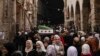 People walk at the Hamidiyeh market at the old city of Damascus on December 11, 2024.