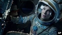 FILE - This film image released by Warner Bros. Pictures shows Sandra Bullock in a scene from the movie "Gravity." 