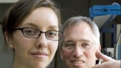 Duke University's Caroline Gamache and Robert Malkin with one of the pouches