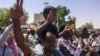 Protesters rally at a demonstration near the military headquarters, April 9, 2019, in the capital Khartoum, Sudan.