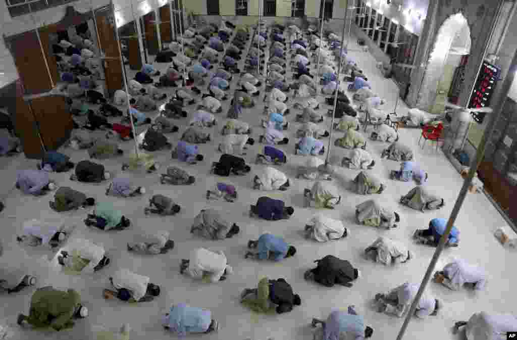 People attend evening prayers while maintaining social distancing to help avoid the spread of the coronavirus, at a mosque in Karachi, Pakistan.