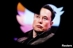 FILE PHOTO: Illustration shows Elon Musk's photo and Twitter logo