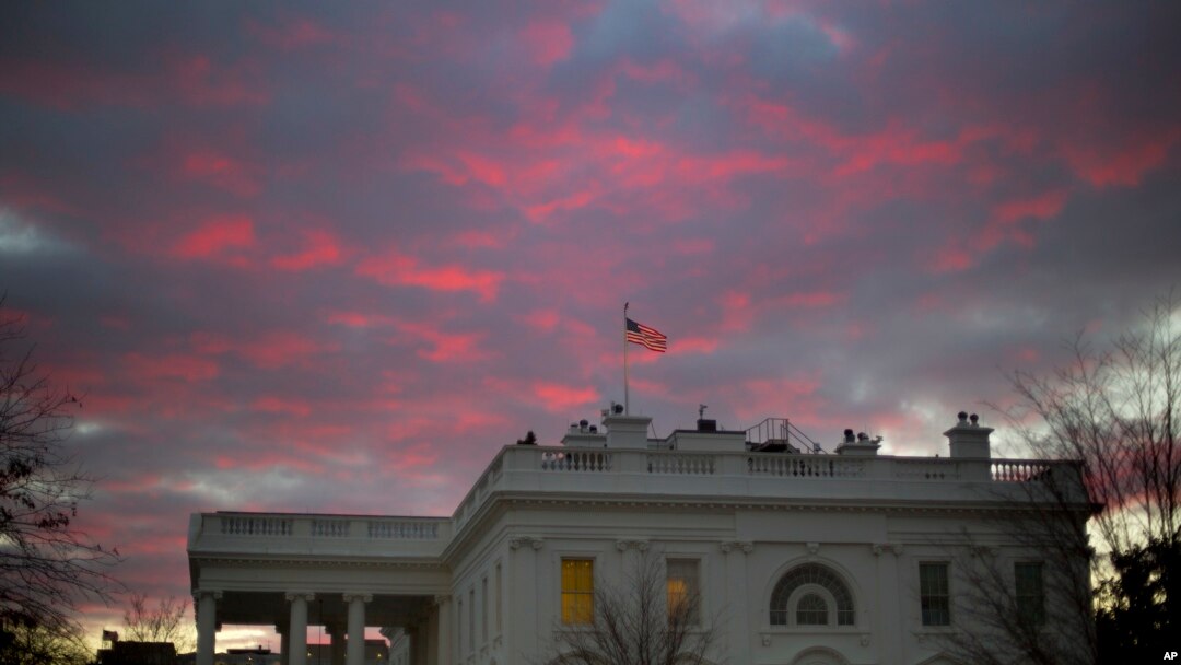 FILE - In this Jan. 27, 2017, photo, day breaks over the White House in Washington. Two weeks into his presidency, Donald Trump has thrown Washington into a state of anxious uncertainty.