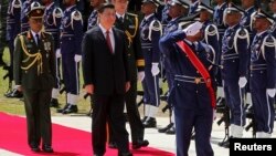 FILE - Chinese President Xi Jinping, second from left, inspects honor guards during an official welcoming ceremony in Male, Maldives, Sept. 15, 2014.