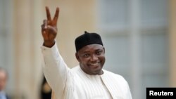 FILE - Gambian President Adama Barrow leaves the Elysee Palace after a meeting with French leaders in Paris, March 15, 2017. A new Gallup poll finds 72 percent of Gambians approve of Barrow's leadership to date. 