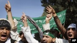 University students of Nangarhar shout anti-U.S. and Afghan government slogans during a demonstration in Jalalabad, east of Kabul, Afghanistan on November 20, 2011.