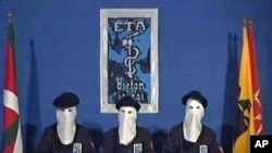 In this image taken from video, masked members of the militant Basque separatist group ETA declare a permanent cease-fire in a video distributed to Spanish media, Jan 10, 2011