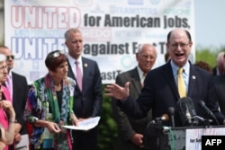 FILE - U.S. Rep. Brad Sherman of California and fellow Democratic members of Congress hold a news conference to voice their opposition to the Trans-Pacific Partnership trade deal and fast-track trade authority for the president at the U.S. Capitol in Washington, June 10, 2015.