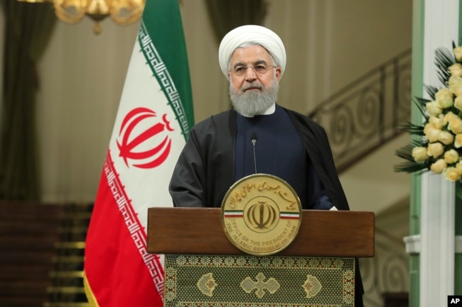 In this photo released by official website of the office of the Iranian Presidency, President Hassan Rouhani attends a joint press briefing with his Iraqi counterpart Barham Salih after their meeting at the Saadabad Palace in Tehran, Iran, Nov. 17, 2018.