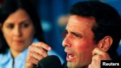 FILE- Venezuela's opposition leader Henrique Capriles talks to the media during a news conference in Caracas, Apr. 18, 2013.